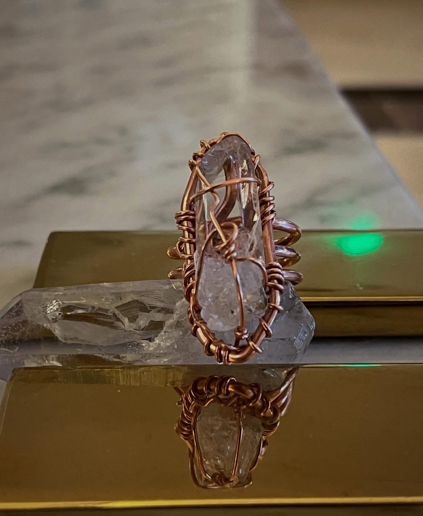 CLEAR QUARTZ RING IN COPPER